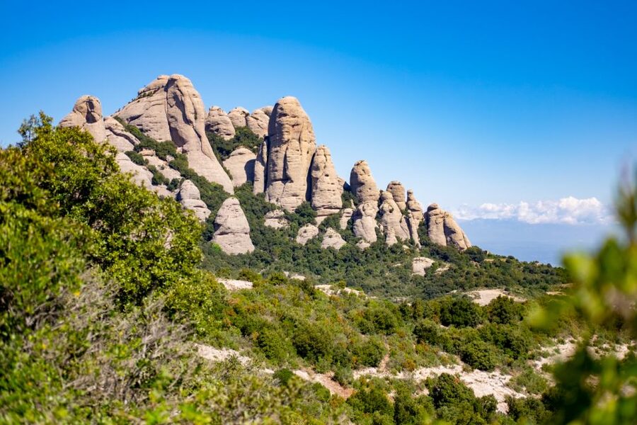 Barcelona: Sitges & Montserrat Monastery Tour with Easy Hike - Montserrat: monastery, basilica, and mountain stories