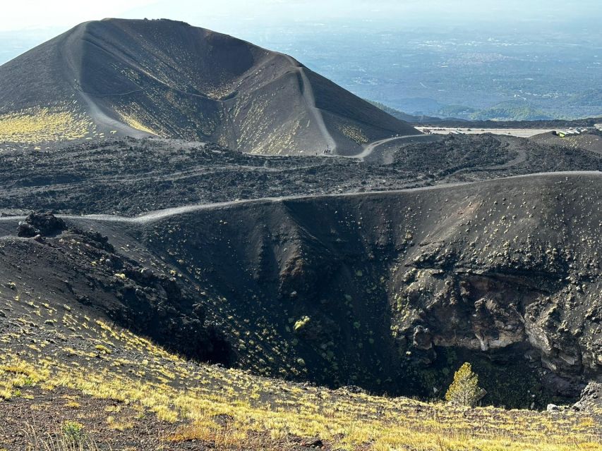 Catania: Etna Morning or Sunset Trek with Lava Tunnel & Gear - Morning light or sunset over the black slopes