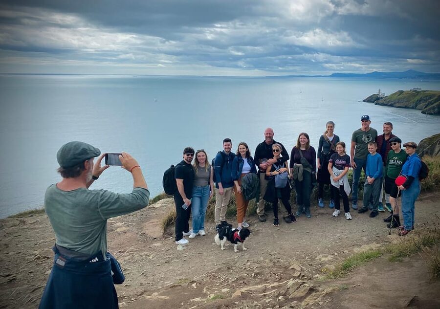 Dublin: Dublin Coastal Hike and Pints & Puppies - Climbing toward Howth’s cliffs