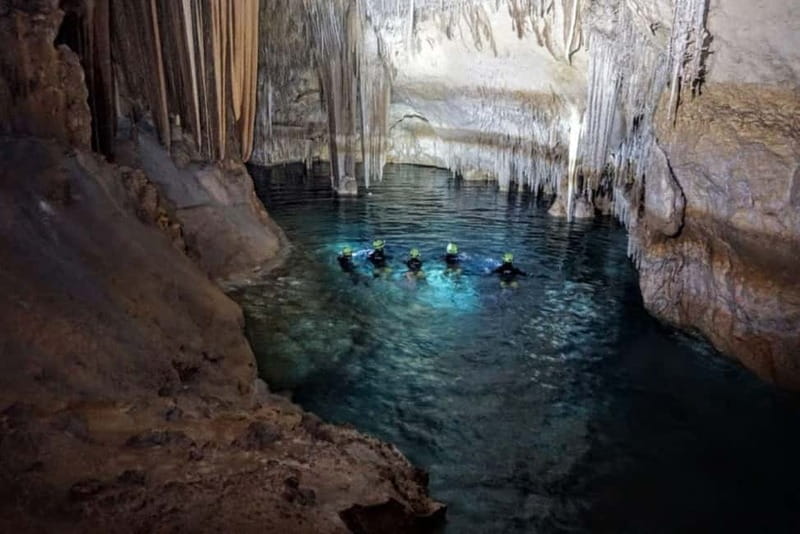 Estany d'en Mas: Coastal Hike, Abseil & Sea Cave Exploration - Abseiling 15 to 20 meters into the cave