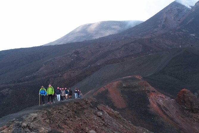 Etna excursion 3000 meters with 4x4 cable car and Trekking - Returning by cable car through black volcanic sand