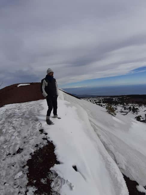 Etna: Jeep excursion and hike suitable for everyone. Free shoes and jacket - Entering Grotta delle Nevi with helmet and lamp