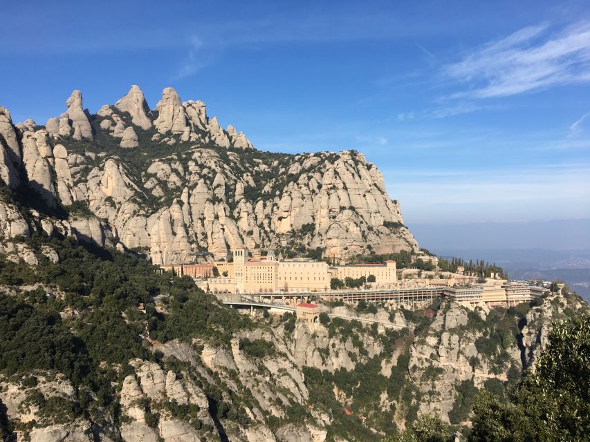 From Barcelona: Montserrat Mountain Hike and Abbey Tour - Free Time At The Local Market
