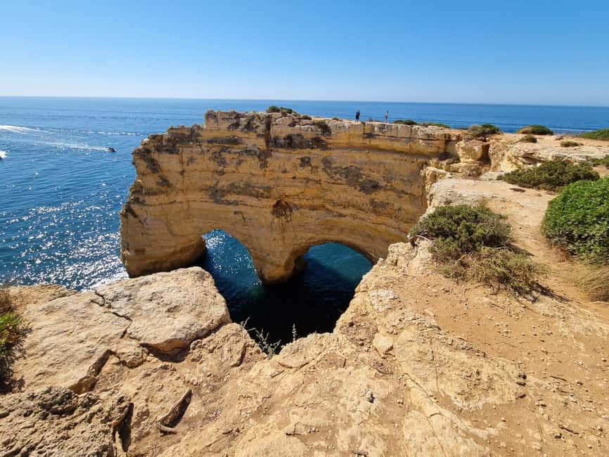 From Faro: Benagil Cliffs Hiking & 4 Treasures Experience - Looking into Benagil Cave from the clifftop