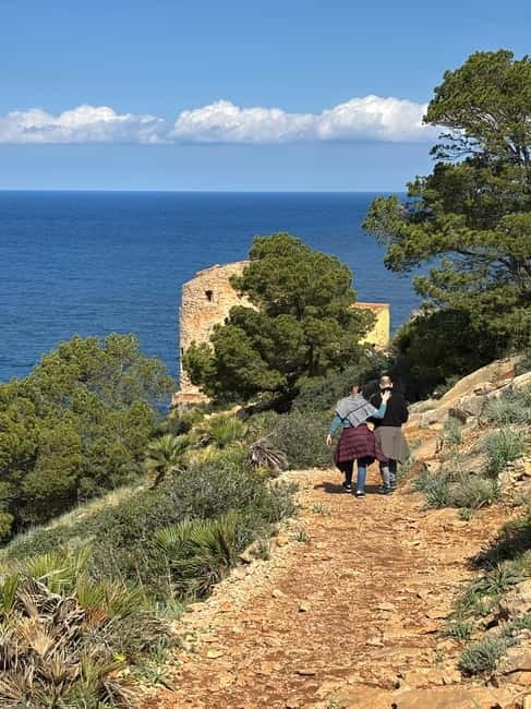 From Palma: Sierra de Tramuntana Hiking with small Picnic - A picnic with local products and a mountain view