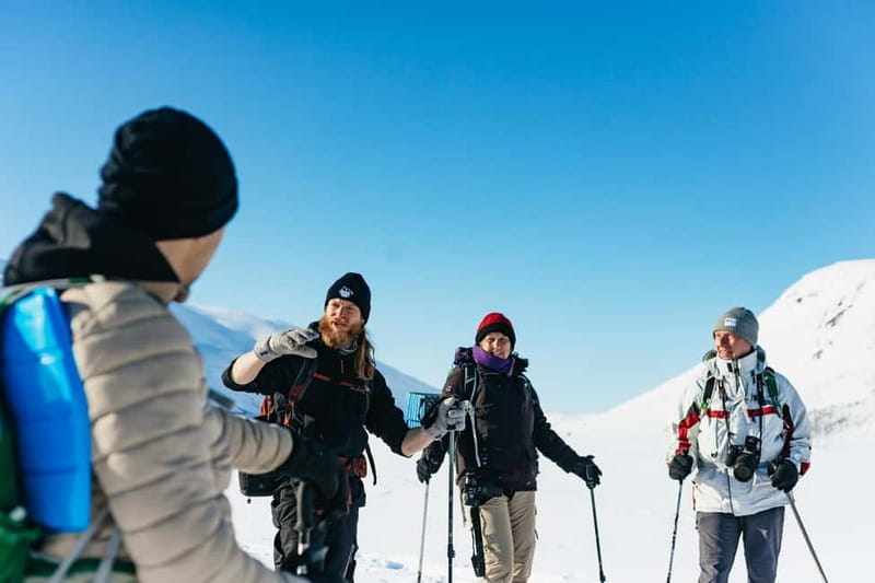 From Tromsø: Snowshoeing Hike with Picnic Lunch and Photos - The Tromsø meeting point and the ride west