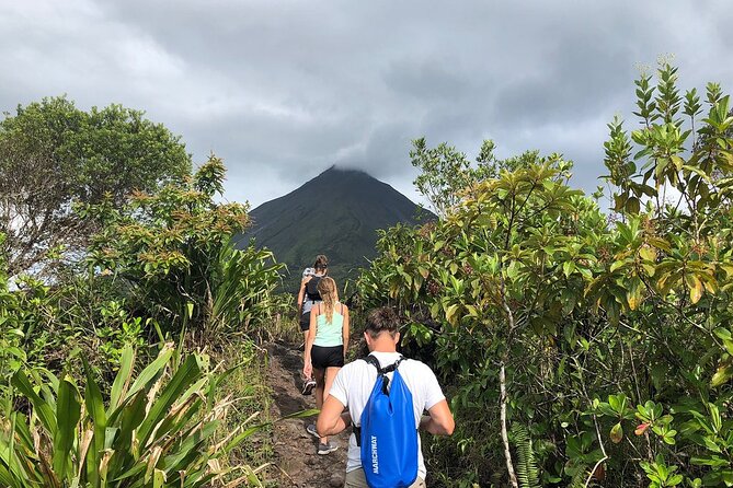 Full Day Tour with Safari Float, Waterfall and Volcano Hike - Hiking at Arenal Volcano over old lava trails
