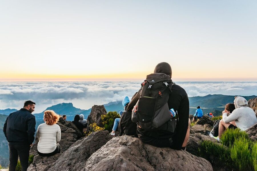 Walkers on the Pico do Arieiro ridge above a sea of cloud, Madeira
