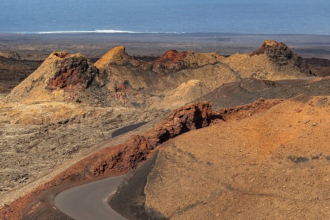 Volcano Hike - Timanfaya eruptions - Climbing a volcanic cone and looking into a crater